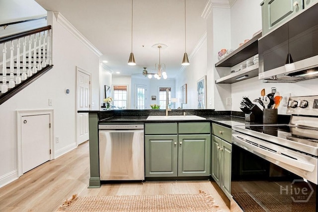 329 W Charlton St, Savannah, GA 31401 - kitchen featuring stainless steel appliances, green cabinetry, ornamental molding, a peninsula, and light wood finished floors