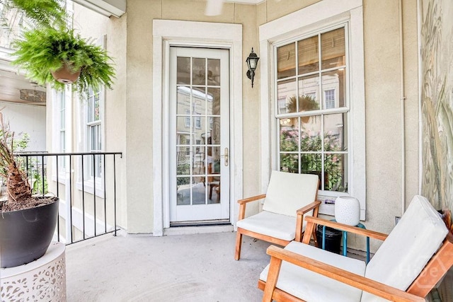 329 W Charlton St, Savannah, GA 31401 - view of exterior entry with stucco siding and covered porch