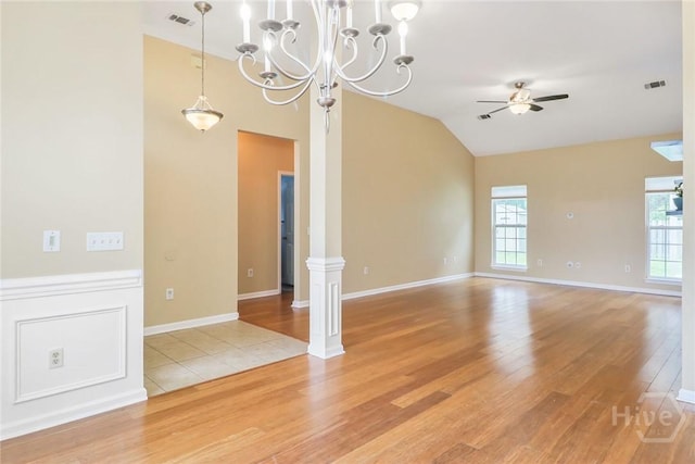 817 Granite Ln, Savannah, GA 31419 - unfurnished room featuring light wood-type flooring, ornate columns, ceiling fan, plenty of natural light, and vaulted ceiling