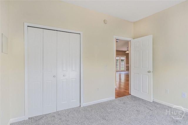 817 Granite Ln, Savannah, GA 31419 - unfurnished bedroom with carpet flooring, a closet, and baseboards