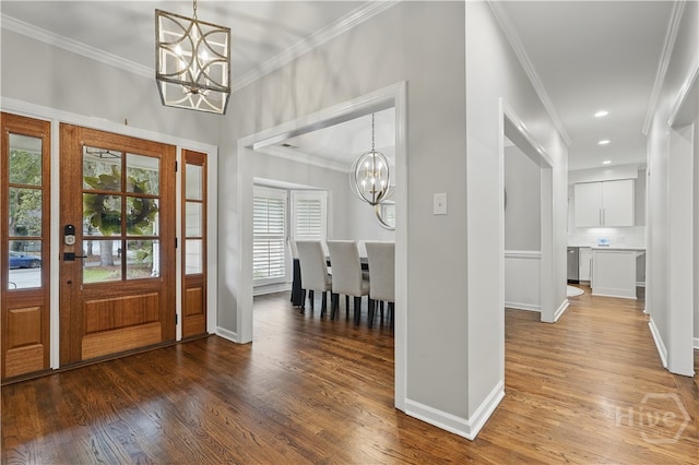 3 Benedictine Retreat Retreat, Savannah, GA 31411 - entrance foyer with a chandelier, crown molding, wood finished floors, baseboards, and recessed lighting