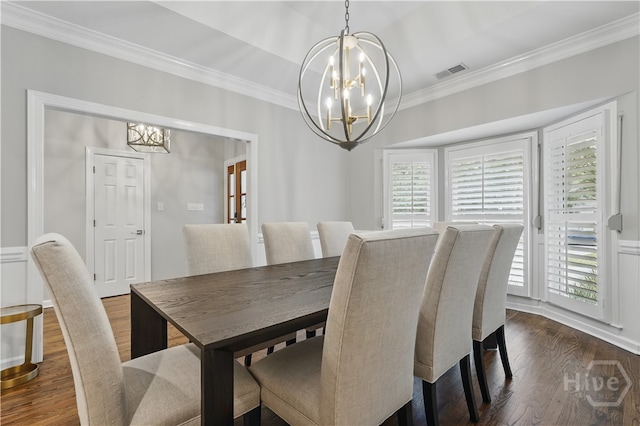 3 Benedictine Retreat Retreat, Savannah, GA 31411 - dining space with a chandelier, crown molding, and dark wood-style flooring