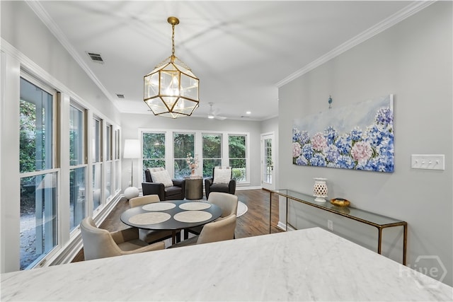 3 Benedictine Retreat Retreat, Savannah, GA 31411 - dining area featuring healthy amount of natural light, wood finished floors, a chandelier, ornamental molding, and recessed lighting