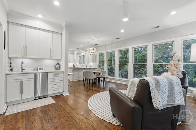 3 Benedictine Retreat Retreat, Savannah, GA 31411 - living area with ornamental molding, recessed lighting, healthy amount of natural light, wet bar, and dark wood-style floors