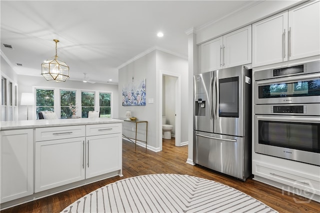 3 Benedictine Retreat Retreat, Savannah, GA 31411 - kitchen with stainless steel appliances, crown molding, white cabinets, light countertops, and pendant lighting