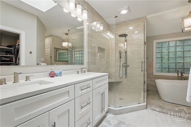 3 Benedictine Retreat Retreat, Savannah, GA 31411 - full bath featuring a stall shower, double vanity, a freestanding bath, a spacious closet, and marble look tiles