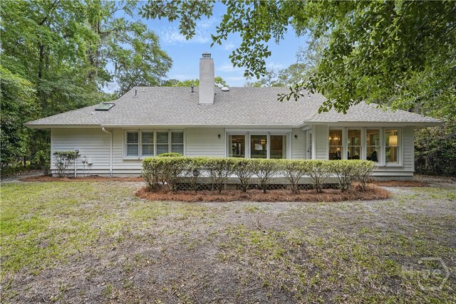 3 Benedictine Retreat Retreat, Savannah, GA 31411 - back of property with a chimney, a shingled roof, and a lawn