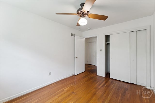 1525 Whitney Rd, Savannah, GA 31406 - unfurnished bedroom featuring wood finished floors, a closet, baseboards, and ceiling fan