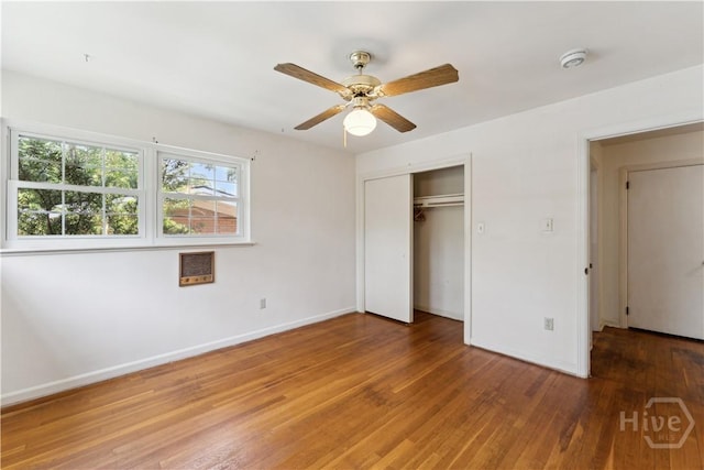 1525 Whitney Rd, Savannah, GA 31406 - unfurnished bedroom with wood finished floors, baseboards, a closet, and ceiling fan