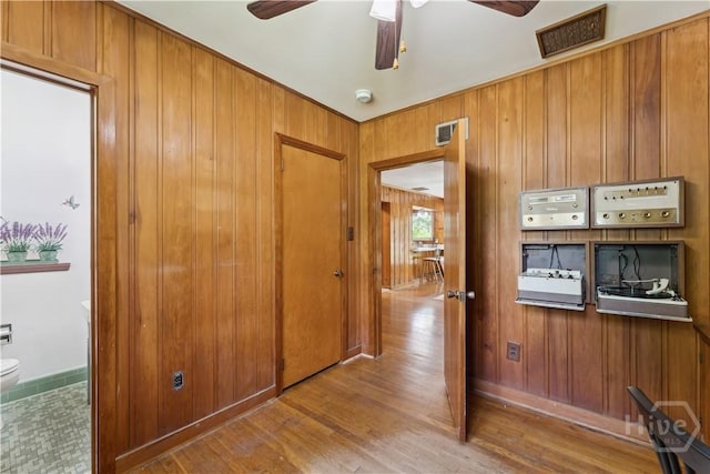 1525 Whitney Rd, Savannah, GA 31406 - hallway with wood finished floors and wooden walls