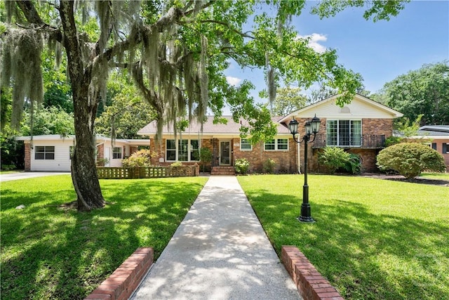 1525 Whitney Rd, Savannah, GA 31406 - view of front of property with brick siding and a front yard