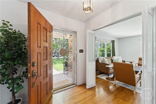 1525 Whitney Rd, Savannah, GA 31406 - foyer entrance featuring light wood-style floors and crown molding