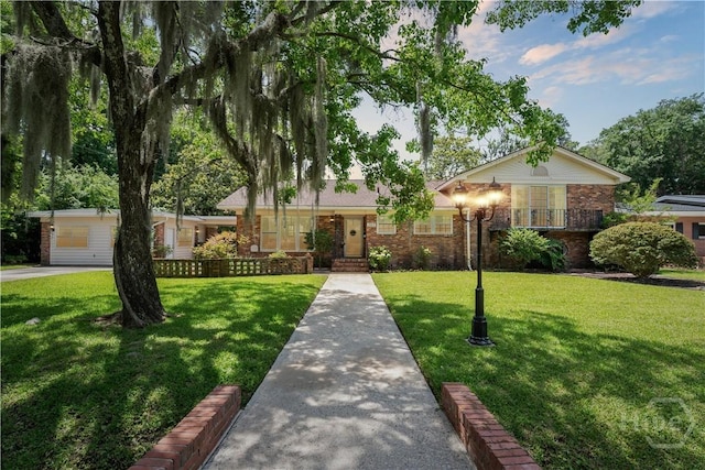 1525 Whitney Rd, Savannah, GA 31406 - ranch-style house with brick siding and a front yard