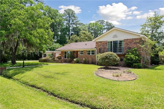 1525 Whitney Rd, Savannah, GA 31406 - view of front of property featuring brick siding and a front yard