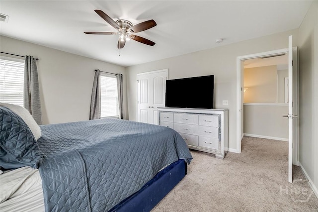 141 Lakepointe Dr, Savannah, GA 31407 - bedroom featuring light colored carpet, baseboards, ceiling fan, and a closet