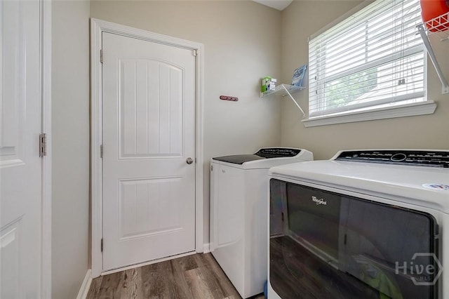141 Lakepointe Dr, Savannah, GA 31407 - laundry area featuring washing machine and clothes dryer, dark wood-type flooring, and baseboards