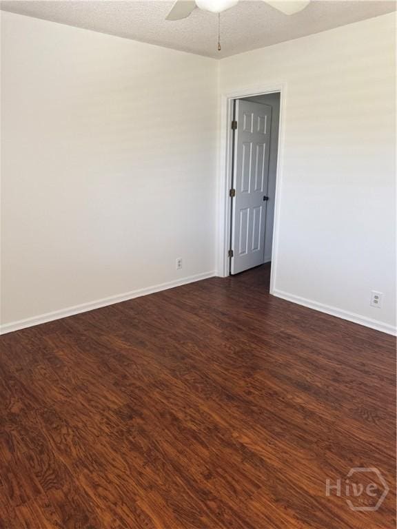 142 Bull River Bluff Dr, Savannah, GA 31410 - empty room with dark wood-style floors, ceiling fan, and baseboards