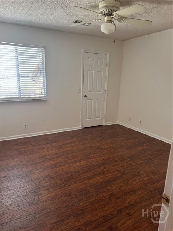 142 Bull River Bluff Dr, Savannah, GA 31410 - unfurnished room featuring ceiling fan, dark wood-style flooring, a textured ceiling, and baseboards