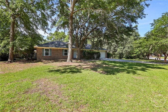 203 Whittington Dr, Savannah, GA 31419 - ranch-style house with asphalt driveway, a garage, and a front yard