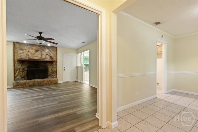203 Whittington Dr, Savannah, GA 31419 - unfurnished living room with a textured ceiling, a ceiling fan, wood finished floors, crown molding, and baseboards