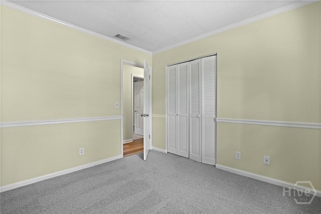 203 Whittington Dr, Savannah, GA 31419 - unfurnished bedroom featuring carpet, ornamental molding, baseboards, and a closet