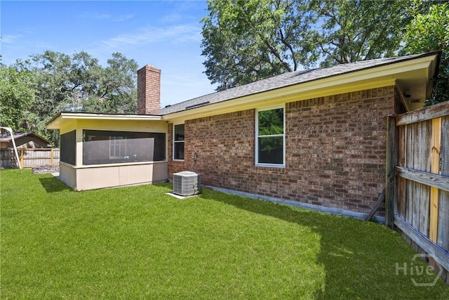 203 Whittington Dr, Savannah, GA 31419 - back of property featuring a chimney, brick siding, and central AC unit