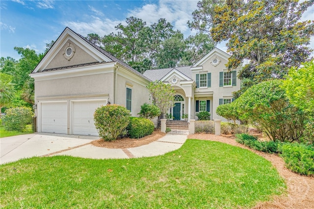 2 Franklin Creek Rd S, Savannah, GA 31411 - view of front of property with stucco siding, driveway, and a front lawn