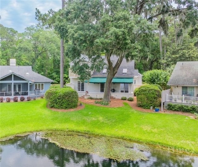 2 Franklin Creek Rd S, Savannah, GA 31411 - rear view of property featuring a yard and a water view