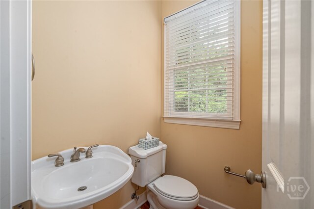 2 Franklin Creek Rd S, Savannah, GA 31411 - half bathroom with toilet, a sink, and baseboards