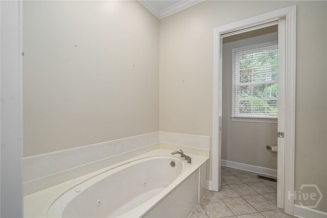 2 Franklin Creek Rd S, Savannah, GA 31411 - bathroom with a tub with jets, crown molding, tile patterned flooring, and baseboards