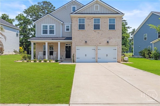333 Waverly Ln, Richmond Hill, GA 31324 - craftsman inspired home featuring board and batten siding, covered porch, concrete driveway, and a front lawn