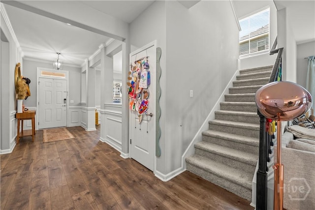 333 Waverly Ln, Richmond Hill, GA 31324 - foyer with dark wood finished floors, stairs, and crown molding