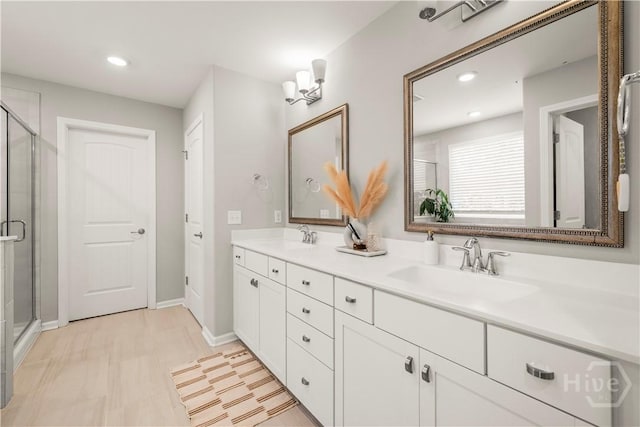 333 Waverly Ln, Richmond Hill, GA 31324 - bathroom with double vanity, a shower stall, recessed lighting, and baseboards