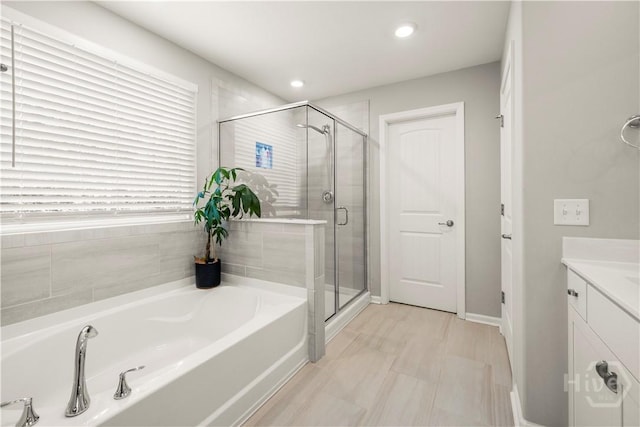 333 Waverly Ln, Richmond Hill, GA 31324 - full bath featuring a bath, a shower stall, vanity, and recessed lighting