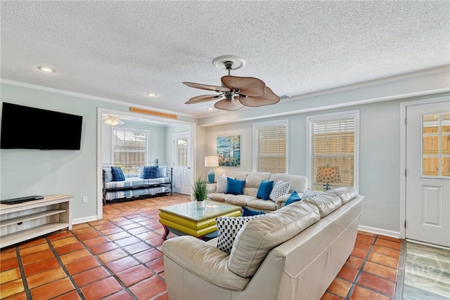 1406 Jones Ave, Tybee Island, GA 31328 - tiled living area featuring plenty of natural light, crown molding, a ceiling fan, a textured ceiling, and recessed lighting