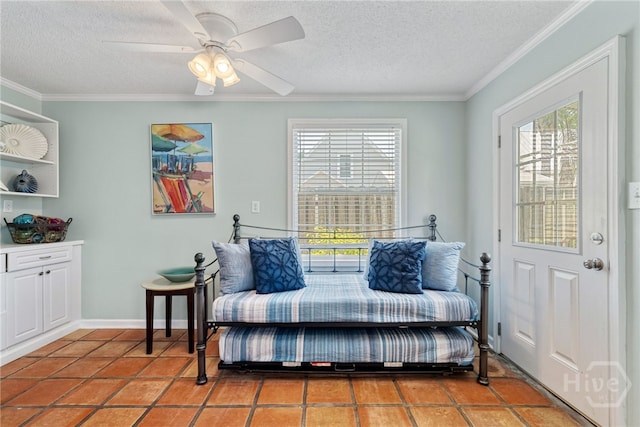 1406 Jones Ave, Tybee Island, GA 31328 - sitting room featuring plenty of natural light, a textured ceiling, ornamental molding, and a ceiling fan