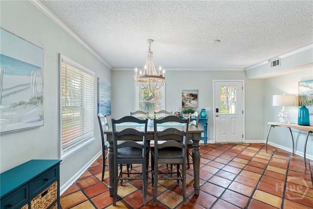1406 Jones Ave, Tybee Island, GA 31328 - tiled dining space with ornamental molding, a chandelier, a textured ceiling, and baseboards