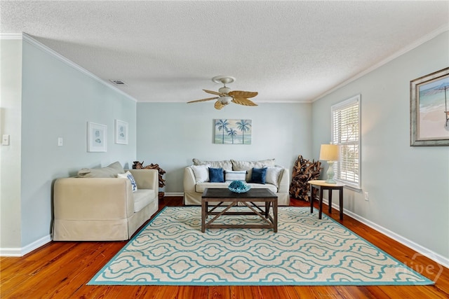 1406 Jones Ave, Tybee Island, GA 31328 - living room with crown molding, wood finished floors, a textured ceiling, and ceiling fan