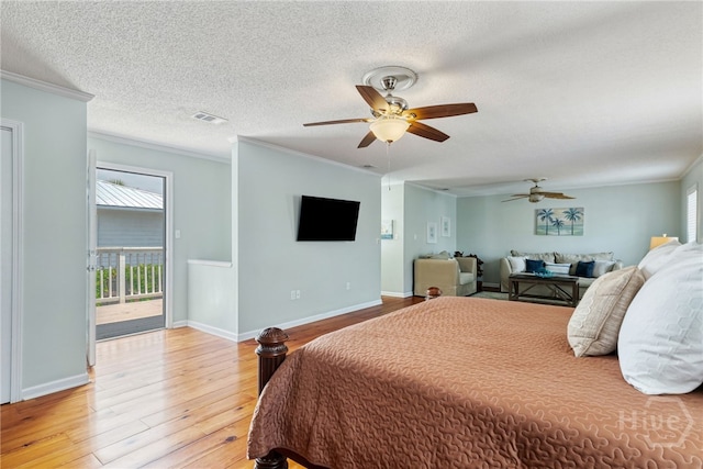 1406 Jones Ave, Tybee Island, GA 31328 - bedroom with access to outside, crown molding, light wood-style flooring, a textured ceiling, and ceiling fan