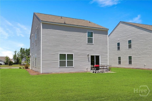 407 Coconut Dr, Bloomingdale, GA 31322 - back of house with a yard and a patio