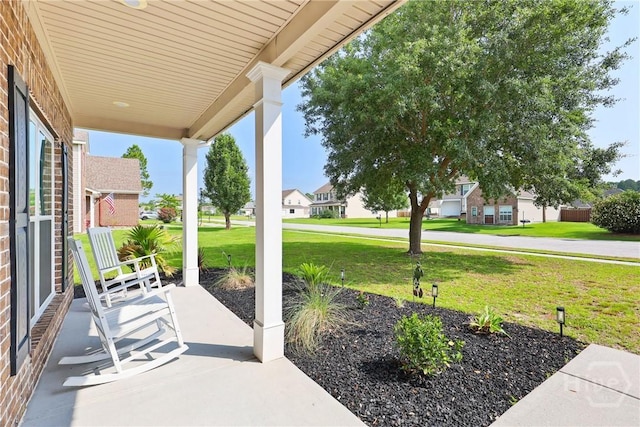 115 Meadowlands Dr, Rincon, GA 31326 - porch with a lawn and a residential view