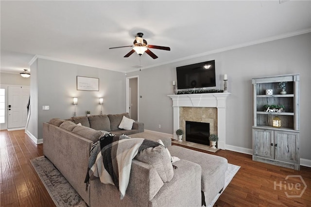 115 Meadowlands Dr, Rincon, GA 31326 - living area featuring a ceiling fan, a tiled fireplace, wood finished floors, baseboards, and ornamental molding