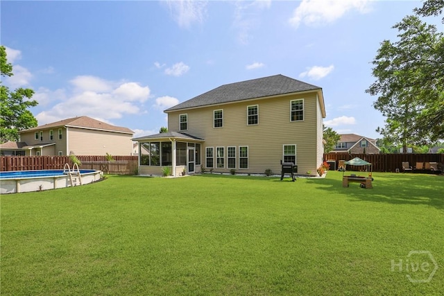 115 Meadowlands Dr, Rincon, GA 31326 - rear view of house featuring a sunroom