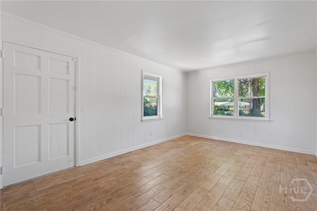 1939 Colonial Dr, Savannah, GA 31406 - spare room with wood finished floors, crown molding, and baseboards