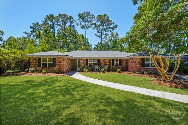 1939 Colonial Dr, Savannah, GA 31406 - ranch-style house featuring a front yard and brick siding