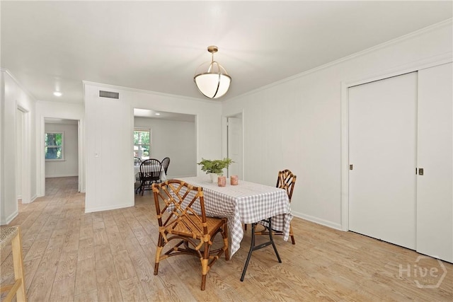 1939 Colonial Dr, Savannah, GA 31406 - dining room with ornamental molding, light wood finished floors, and baseboards