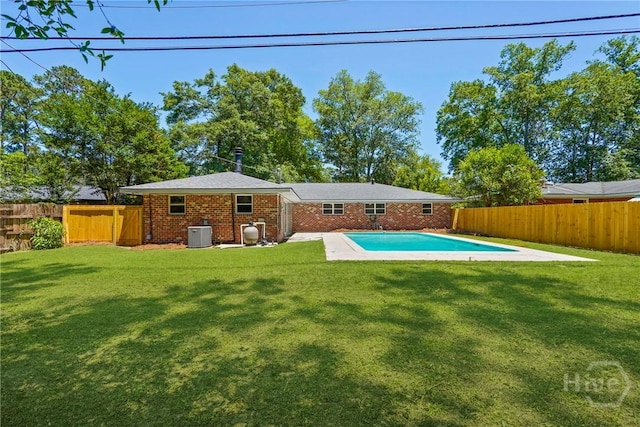 1939 Colonial Dr, Savannah, GA 31406 - rear view of property featuring brick siding, cooling unit, and a patio
