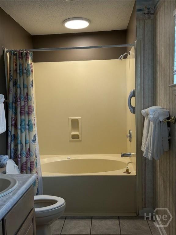 1 Center St Unit 3, Tybee Island, GA 31328 - bathroom featuring tile patterned floors, shower / tub combo with curtain, toilet, vanity, and a textured ceiling