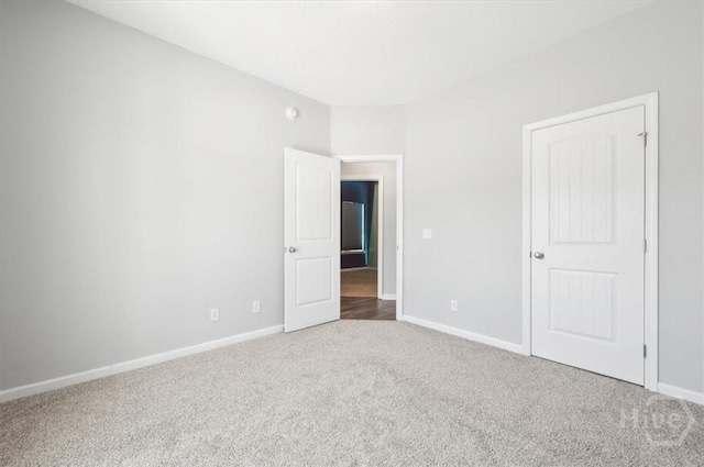 301 Akins Ranch Rd NE, Ludowici, GA 31316 - unfurnished bedroom with carpet and baseboards