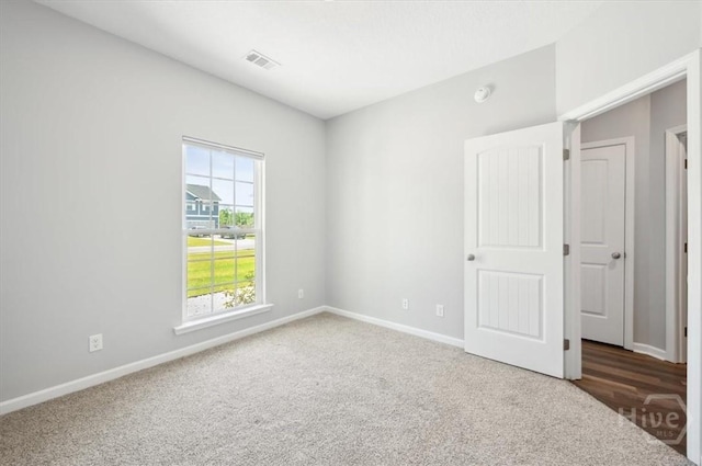 301 Akins Ranch Rd NE, Ludowici, GA 31316 - unfurnished bedroom featuring carpet and baseboards